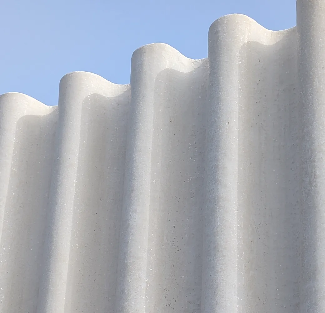 White fluted façade panels against a blue sky