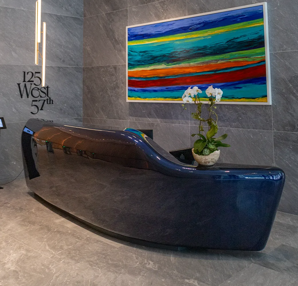 Glossy navy reception desk in a building lobby